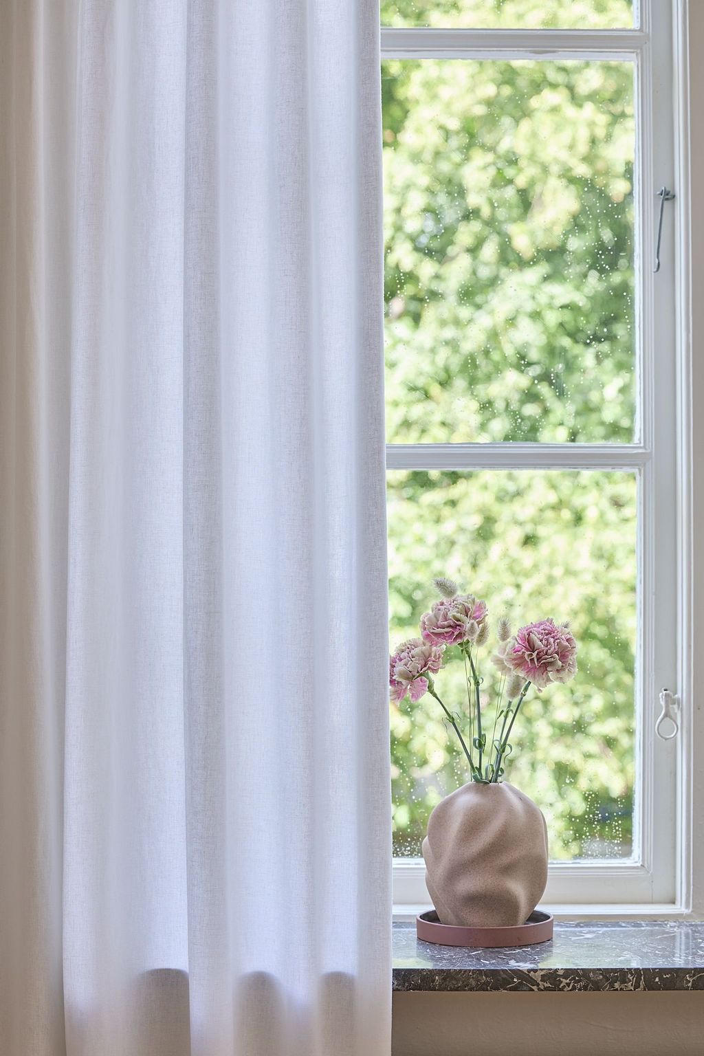 White curtain in a linen blend